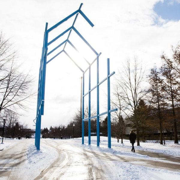 winter photo of Transformational Link sculpture on campus